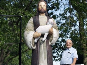 Dave Szusz, publisher of the Shepherd’s Guide, is shown at his Windsor, Ontario home with a 10-foot inflatable Jesus holding a sheep that is part of his parade float. (Dan Janisse/Windsor Star)