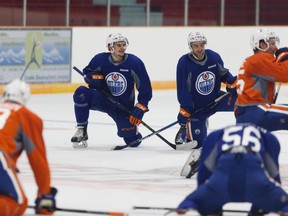 Players stretch during the Edmonton Oilers development camp at Jasper Arena on Wednesday, July 5, 2017.