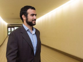 Omar Khadr leaves court after a judge ruled to relax bail conditions in Edmonton on Friday, Sept. 18, 2015. (THE CANADIAN PRESS/Amber Bracken)