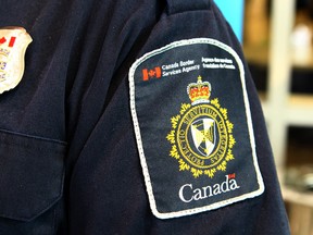 A Canadian Border Services Agency officer's shoulder flash is shown at the Calgary Courts Centre on April 22, 2017. (Jim Wells/Postmedia Network)