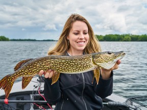 Columnist Ashley Rae with a northern pike caught and released on Big Rideau Lake. (Submitted photo)