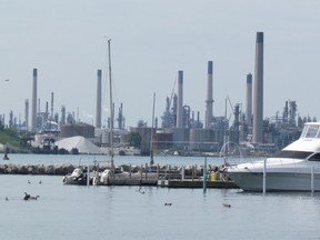 Industries in Chemical Valley are shown in this view of Sarnia Bay Thursday in Sarnia, Ont. Lawyers with the group Ecojustice are going to court over what they say is an eight-year delay in Ontario meeting a promise to review how it regulates industrial air pollution. (Paul Morden/Sarnia Observer)