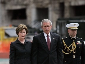 NEW YORK - SEPTEMBER 10:  U.S. President George W. Bush lays a wreath along with First Lady Laura Bush at the World Trade Center site honoring those killed in the September 11th terrorist attacks September 10, 2006 in New York City. Tomorrow is the fifth anniversary of the attacks.  (Photo by Mario Tama/Getty Images)