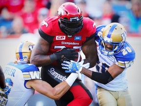 Calgary Stampeders Jerome Messam with a touchdown against the Winnipeg Blue Bombers during CFL football in Calgary, Alta., on Friday, September 23, 2016. The Bombers will get Calgary at home on Friday, but they haven't had much success there either. (AL CHAREST/POSTMEDIA)