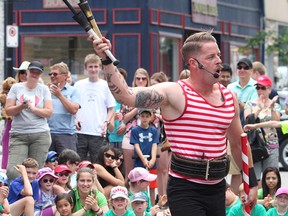 Mighty Mike, of Toronto, performs on Princess Street during the first day of the Kingston Buskers Rendezvous on Thursday. The event continues through Sunday. (Ian MacAlpine/The Whig-Standard)