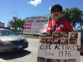 CUPE member Carmelita Tananchayanon rallies outside HSC on Thursday. (Jason Friesen/Winnipeg Sun/Postmedia Network)