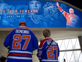 Patrick Bohnet (left) and Vera Buzak (right) pay their respects at Ford Hall in Rogers Place where a celebration of life for former Edmonton Oiler Dave Semenko was held on July 6, 2017. Semenko died of cancer at the age of 59. LARRY WONG/POSTMEDIA