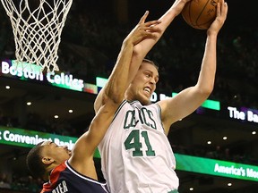 Kelly Olynyk of the Boston Celtics grabs a rebound against Otto Porter Jr. of the Washington Wizards during Game 7 of the NBA Eastern Conference Semifinals at TD Garden on May 15, 2017. (Elsa/Getty Images)