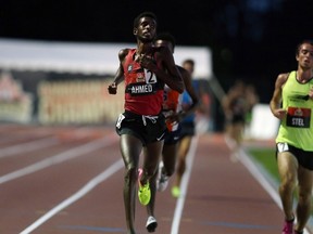 Mohammed Ahmed of St. Catherines, Ont., crosses the finish line to win the 5,000-metre race at the Canadian Track and Field Chaampionships, in Ottawa on July 6, 2017. (THE CANADIAN PRESS/Fred Chartrand)