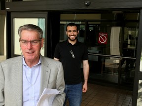 Lawyer Denis Edney and Omar Khadr smilie as they walk outside the Edmonton Law Courts Buildings on Thursday afternoon on May 7, 2015 after Alberta's highest court released the former Guantanamo Bay detainee on bail Thursday pending the appeal of his convictions in the United States. Tom Braid/Edmonton Sun