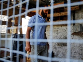 In this photo dated Sunday, June 18, 2017, Salah Sassi , a former Guantanamo detainee, is pictured during an interview with the Associated Press at his home in Bizerte, northern Tunisia. Two Tunisians freed after years in the U.S. detention center at Guantanamo Bay, Cuba, say they are harassed relentlessly by security forces at home. Neither has ever been charged, and they say they almost yearn to return to captivity in Cuba than face the injustice and isolation they say they now endure.(AP Photo/Hassene Dridi)