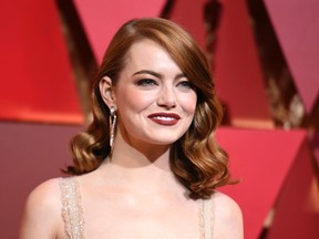 In this Feb. 26, 2017 file photo, actress Emma Stone arrives at the Oscars in Los Angeles. Stone says that male co-stars have taken pay cuts to ensure she received equal pay on films.(Richard Shotwell/Invision/AP, File)