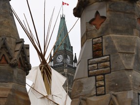 A large teepee erected by indigenous demonstrators to kick off a four-day Canada Day protest stands in front of Parliament Hill in Ottawa on Thursday, June 29, 2017. THE CANADIAN PRESS/Justin Tang