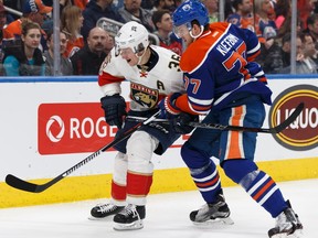 Edmonton's Oscar Klefbom (77) battles Florida's Jussi Jokinen (36) during the second period of a NHL game between the Edmonton Oilers and the Florida Panthers at Rogers Place on Wednesday, January 18, 2017.