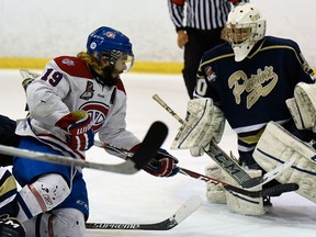 Kingston Voyageurs Adam Brady gets caught up in front of Toronto Patriots Mathew Robson during Game 6 of the Ontario Junior Hockey League Buckland Cup final action at the Invista Centre in Kingston on April 20 2015. (James Paddle-Grant/The Kingston Whig-Standard/Postmedia Network)