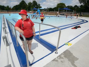 Pool manager Daniella Poloni shows off the new handicapped access ramp and beach entry at Southcrest Pool in London Friday. The $1.7-million renovation of the pool and property officially opened this week. (MORRIS LAMONT, The London Free Press)