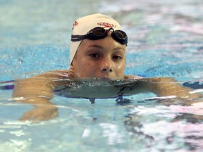 Penny Oleksiak takes a breather during a workout at the Pan Am Sports Centre in preparation for the FINA World Championships in Toronto on July 7, 2017. (Jack Boland/Toronto Sun/Postmedia Network)