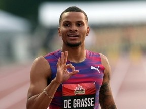 Andre De Grasse of Toronto gestures to the crowd after winning gold in the men's 100-metre race at the Canadian Track and Field Championships in Ottawa on July 7, 2017. (THE CANADIAN PRESS/Fred Chartrand)