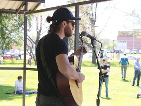 Musician Josh Turnbull entertains in Memorial Park as part of the Canada 150 Summer Series hosted by Vianet on Wednesday. Four more concerts will follow on upcoming Wednesdays from 12:30-1:30 p.m. Vianet is hosting the concerts along with their partners Up Here and the City of Greater Sudbury. (GINO DONATO/THE SUDBURY STAR)