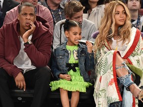 (L-R) Jay-Z, Blue Ivy Carter and Beyonce attend the 66th NBA All-Star Game at Smoothie King Center on Feb. 19, 2017 in New Orleans, La.  (PTheo Wargo/Getty Images)