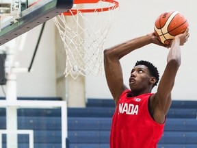 R.J. Barrett, 17, slam dunks the ball during his U19 basketball Canada team practice in Mississauga, Ont., on Tuesday, June 20, 2017. (Nathan Denette/THE CANADIAN PRESS)