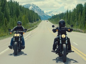 Johanna Poultney hosted motorcycle rider Eduardo Gutierrez from Mexico on a six-day tour through the Rocky Mountains to celebrate Harley-Davidson's 100 year anniversary in Canada.