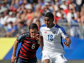 United States' Kelyn Rowe (6) challenges Panama's Miguel Camargo (18) for the ball during a CONCACAF Gold Cup soccer match Saturday, July 8, 2017, in Nashville, Tenn. (AP Photo/Mark Humphrey)