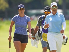 Katherine Kirk, right, chats with Jaye Marie Green during the third round of the Thornberry Creek LPGA Classic golf tournament Saturday, July 8, 2017 in Oneida, Wis. (Jim Matthews/The Post-Crescent via AP)