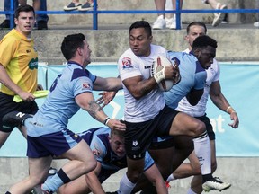 Quentin Laulu-Togaga'e of the Toronto Wolfpack breaks through played the All Golds defence at Lamport Stadium in Toronto on Saturday July 8, 2017. (Craig Robertson/Toronto Sun/Postmedia Network)