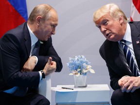 In this Friday, July 7, 2017, file photo U.S. President Donald Trump meets with Russian President Vladimir Putin at the G-20 Summit in Hamburg. A separate US-Russia-brokered truce for southern Syria, brokered by the U.S. and Russia, is meant to help allay growing concerns by neighboring Jordan and Israel about Iranian military ambitions in the area. (AP Photo/Evan Vucci, File)