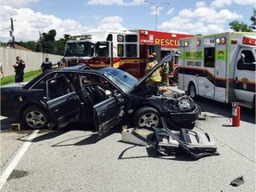 Paramedics and a fire crew are at the scene of a rollover on Highway 417 near Maitland on Sunday, July 8, 2017.