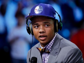 In this June 22, 2017, file photo, Washington's Markelle Fultz answers questions during an interview after being selected by the Philadelphia 76ers as the No.1 overall pick during the NBA basketball draft in New York. (AP Photo/Frank Franklin II, File)