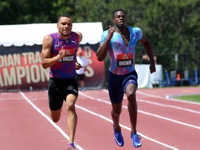 Andre De Grasse, left, takes the lead to the finish line beating Aaron Brown, right, to win gold in men's 200-metre race at the Canadian Track and Field Championships in Ottawa, Sunday, July 9, 2017. (Fred Chartrand/THE CANADIAN PRESS)