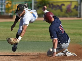 Edmonton Prospects Aidan Huggins (11) loses the ball trying to tag out Lethbridge Bulls 51 (name was not on roster) on a steal to second base during Western Major  Baseball League action at Re/Max Field in Edmonton, July 6, 2017.