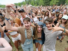 Christopher, Freja and Oliver dance while listening to performers Chali 2na & the House of Vibe, Desi Sub Cultures and DJ Shub at the 44th annual Winnipeg Folk Festival at Birds Hill Provincial Park located just outside Winnipeg, Man., on Sunday, July 9, 2017. (Brook Jones/Selkirk Journal/Postmedia Network)