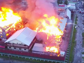 A screengrab from a YouTube video appears to show a prison in Georgetown going up in flames.