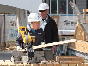 Former U.S. President Jimmy Carter works at Habitat for Humanity site in South East Edmonton on Monday July 10, 2017. David Bloom/Postmedia