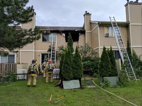 Firefighters quickly upgraded a blaze in a Herongate townhouse to a second-alarm Monday to keep the flames from spreading.