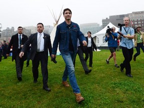 Prime Minister Justin Trudeau leaves a teepee on Parliament Hill in Ottawa on Friday, June 30, 2017. THE CANADIAN PRESS/Sean Kilpatrick