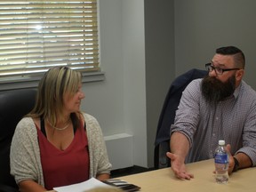 Alberta Municipal Affairs Minister Shaye Anderson (right) speaks with Becky Wells of Wellspring Family Resource and Crisis Centre (Jeremy Appel | Whitecourt Star).