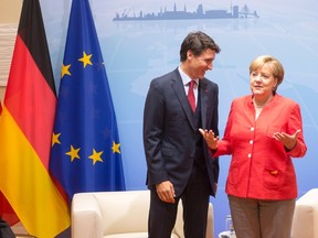 Prime Minister Justin Trudeau greets German Chancellor Angela Merkel during a bilateral meeting at the G20 summit Friday, July 7, 2017 in Hamburg, Germany. THE CANADIAN PRESS/Ryan Remiorz