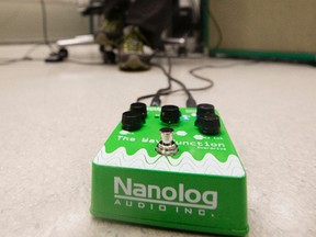 National Research Council of Canada Research Officer Adam Bergen plays his guitar in a lab at the National Institute for Nanotechnology, in Edmonton Monday July 10, 2017.