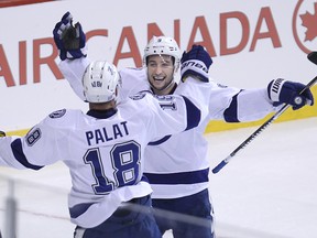 Tampa Bay Lightning centre Tyler Johnson (right) congratulates Ondrej Palat on his goal against the Winnipeg Jets during NHL action at MTS Centre in Winnipeg on Oct. 24, 2014. (Kevin King/Winnipeg Sun)