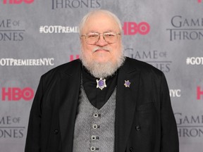 In this March 18, 2014 file photo, author and co-executive producer George R. R. Martin attends the "Game of Thrones" fourth season premiere in New York. (Photo by Evan Agostini/Invision/AP, File)