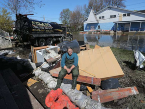 Diane Bourree takes a rest on her belongings outside her Rue Saint-Louis house in Gatineau Monday May 15, 2017. Diane, who is almost 64, never thought she would ever be in this situation so close to retirement. TONY CALDWELL / POSTMEDIA NETWORK