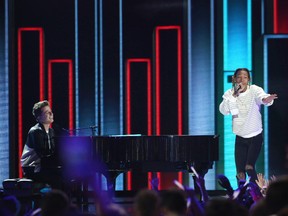 In this March 12, 2016, file photo, Charlie Puth, left, and Wiz Khalifa perform at the Kids' Choice Awards at The Forum in Inglewood, Calif. Wiz Khalifa’s video for “See You Again” featuring Puth is now the site’s most-watched video ever, with more than 2.896 billion views Tuesday, July 11, 2017. (Photo by Matt Sayles/Invision/AP, File)