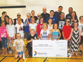 Pictured above are all the people from this year’s Shave to Save  who helped make this year’s event the success that it was. This group is composed of teachers, administrative assistants, parents and students who have all been touched by cancer in some way. Other donations also came in from students and the community who didn’t want to shave their heads but wanted to contribute to the event.
Proceeds from Shave to Save will be going to the Drayton Valley Community Cancer Centre.