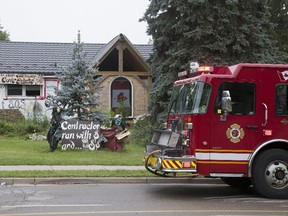 Firefighters put out a fire in the basement of this house at 503 Boler Road in London, Ont. on Tuesday July 11, 2017. (DEREK RUTTAN, The London Free Press)