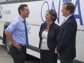 Ontario PC leader Patrick Brown chats with Patricia Riddell-Laemers, executive director of the Early Learning Centre, and Elgin-Middlesex-London MPP Jeff Yurek after a visit Tuesday, July 11 to the centre in St. Thomas. (DEREK RUTTAN, The London Free Press)