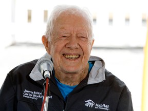 Postmedia Network - 
Former U.S. president Jimmy Carter smiles as he takes part in a press conference at a Habitat for Humanity build site near 22 Avenue and 24 Street on July 10. Seventy-five homes in Edmonton and Fort Saskatchewan will be built during this year’s Jimmy and Rosalynn Carter Work Project.